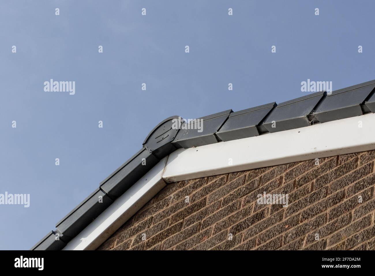 A dry verge roof system on the gable end of a house. Stock Photo