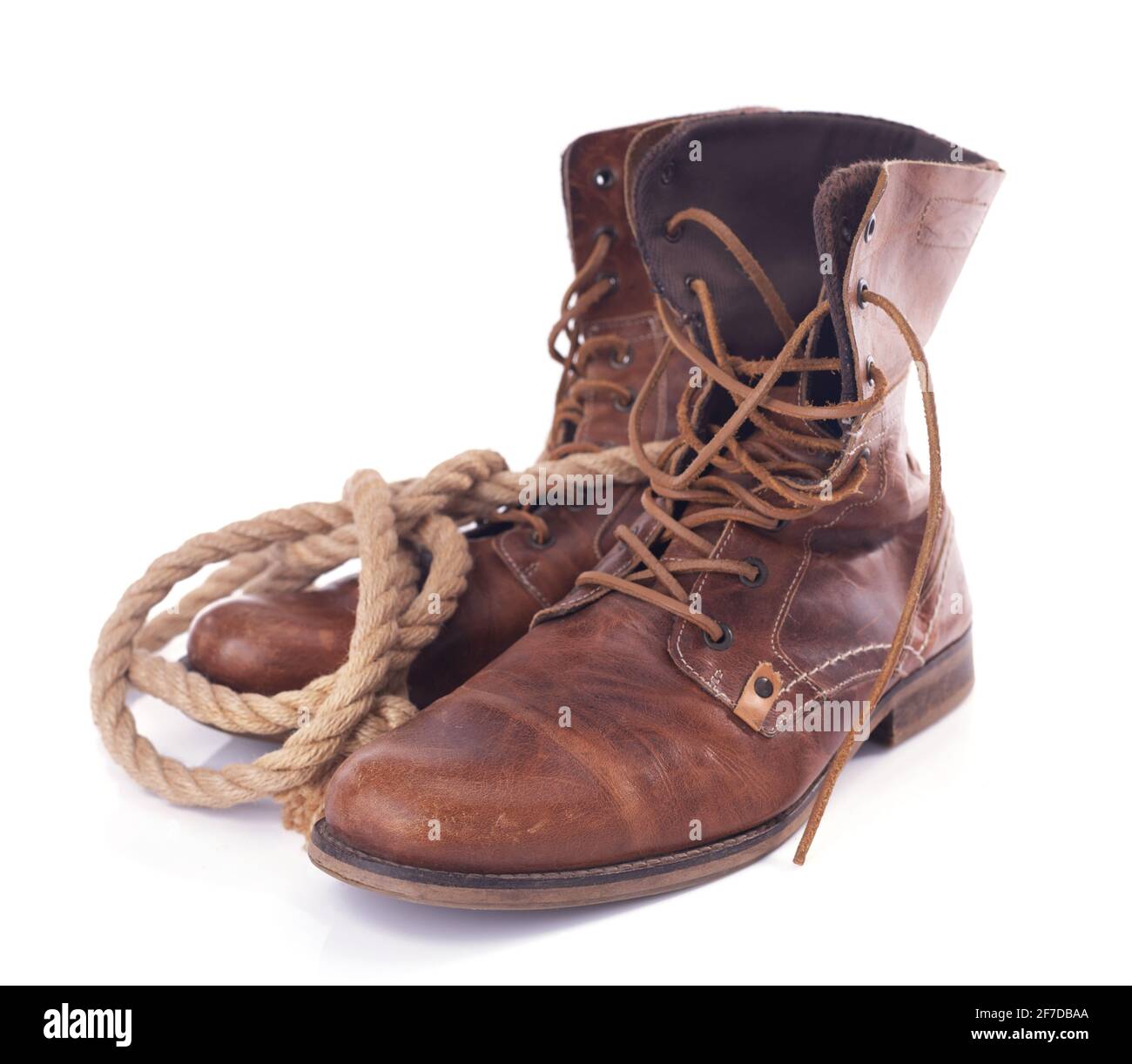 old leather vintage boots shoes isolated on white background, travel  concept with ship rope Stock Photo - Alamy