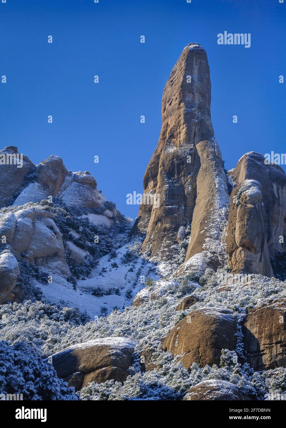 Cavall Bernat rock spire in Montserrat after a snowfall in winter (Barcelona province, Catalonia, Spain) ESP: Cavall Bernat de Montserrat nevado Stock Photo