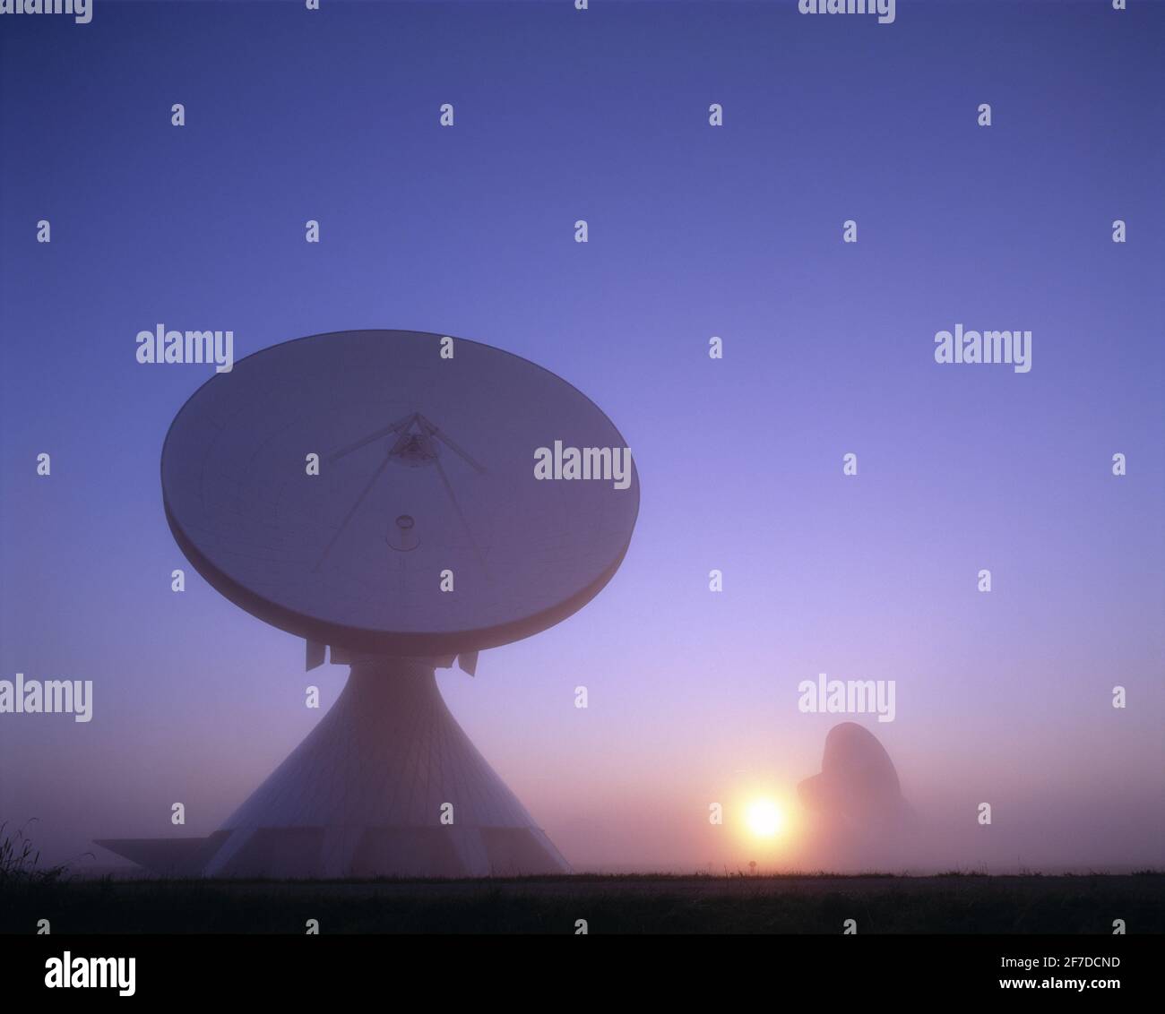 Germany. Bavaria. Raisting Satellite Earth Station.  Parabolic satellite communication antenna at sunrise. Stock Photo
