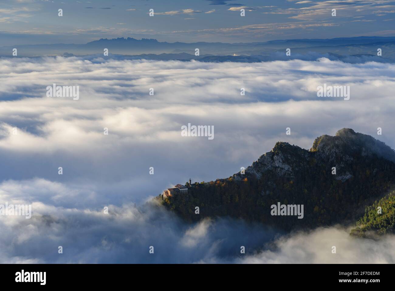 Montserrat mountain in a winter sunrise over a sea of clouds seen from the Figuerassa viewpoint, (Berguedà, Catalonia, Spain, Pyrenees) Stock Photo