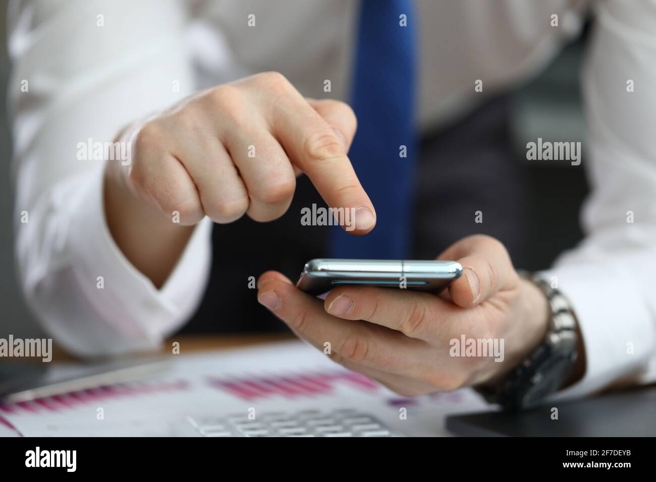 Close-up of businessman using modern smartphone closeup Stock Photo