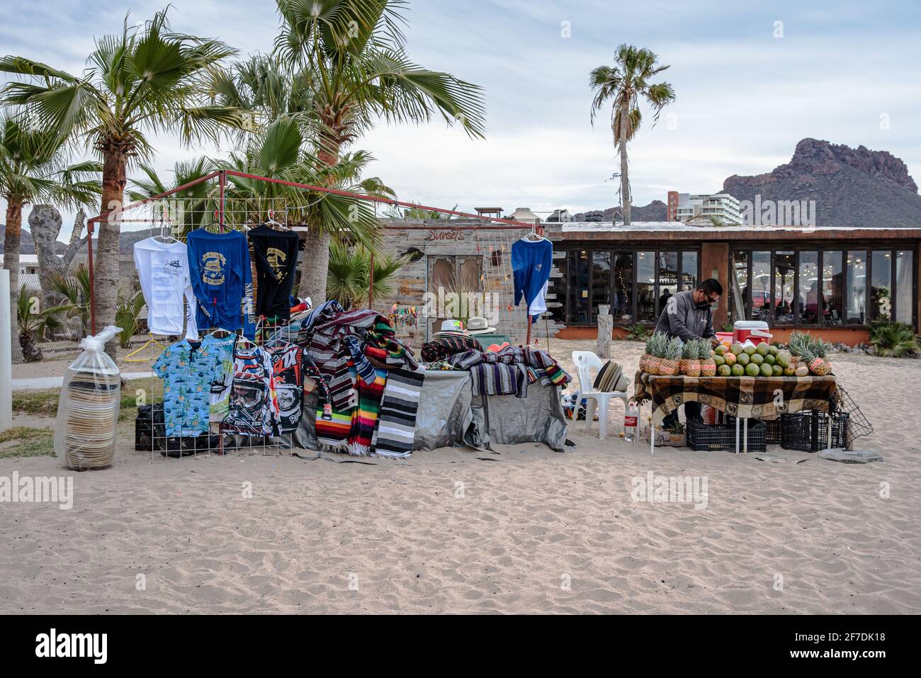 A vendor on the beach in San Carlos, Sonora, Mexico sells souvenirs. Stock Photo