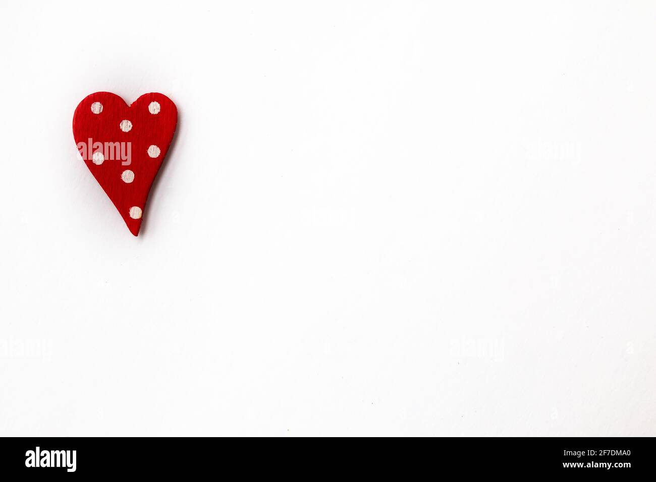 A small, miniature polka dot heart on a white background, isolated, valentine's day 2021 themed concept. Stock Photo