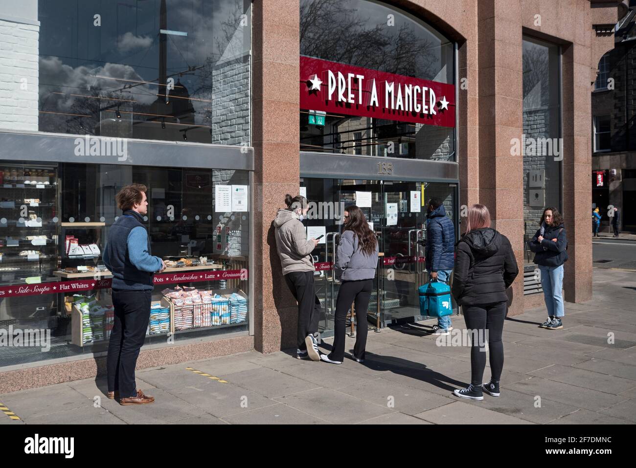 Customers queueing for a takeaway outside Pret a Manger on Princes Street, Edinburgh, Scotland, UK. Stock Photo
