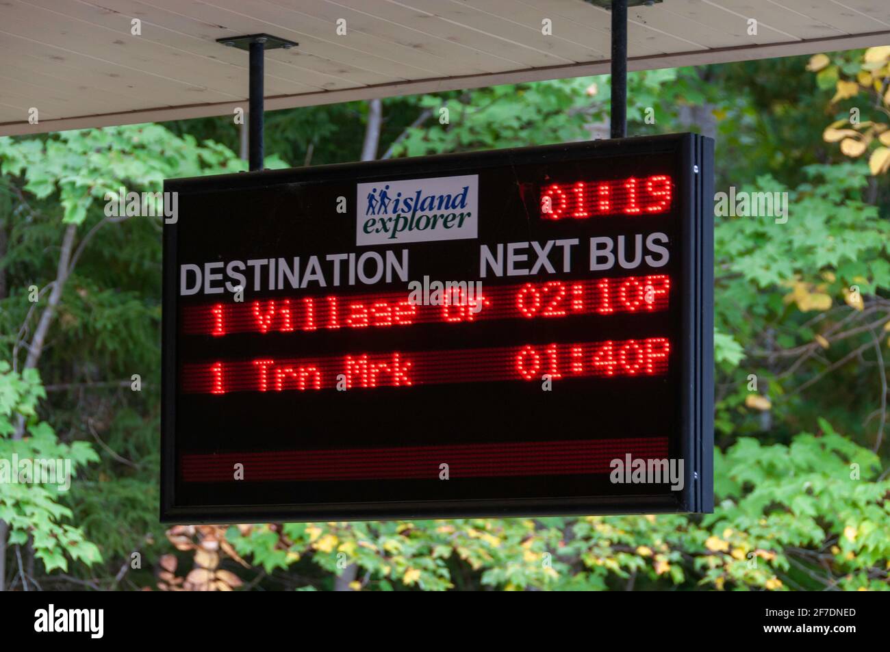Lit up sign advising of bus schedules to and from Mt. Desert Island, Acadia National Park, Maine, USA. Stock Photo