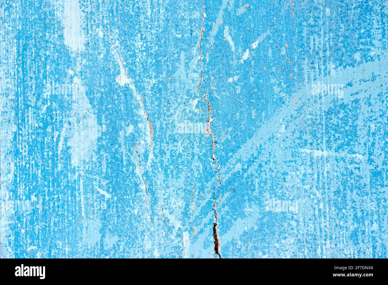 Weathered and scratched old blue painted wood boards. Stock Photo