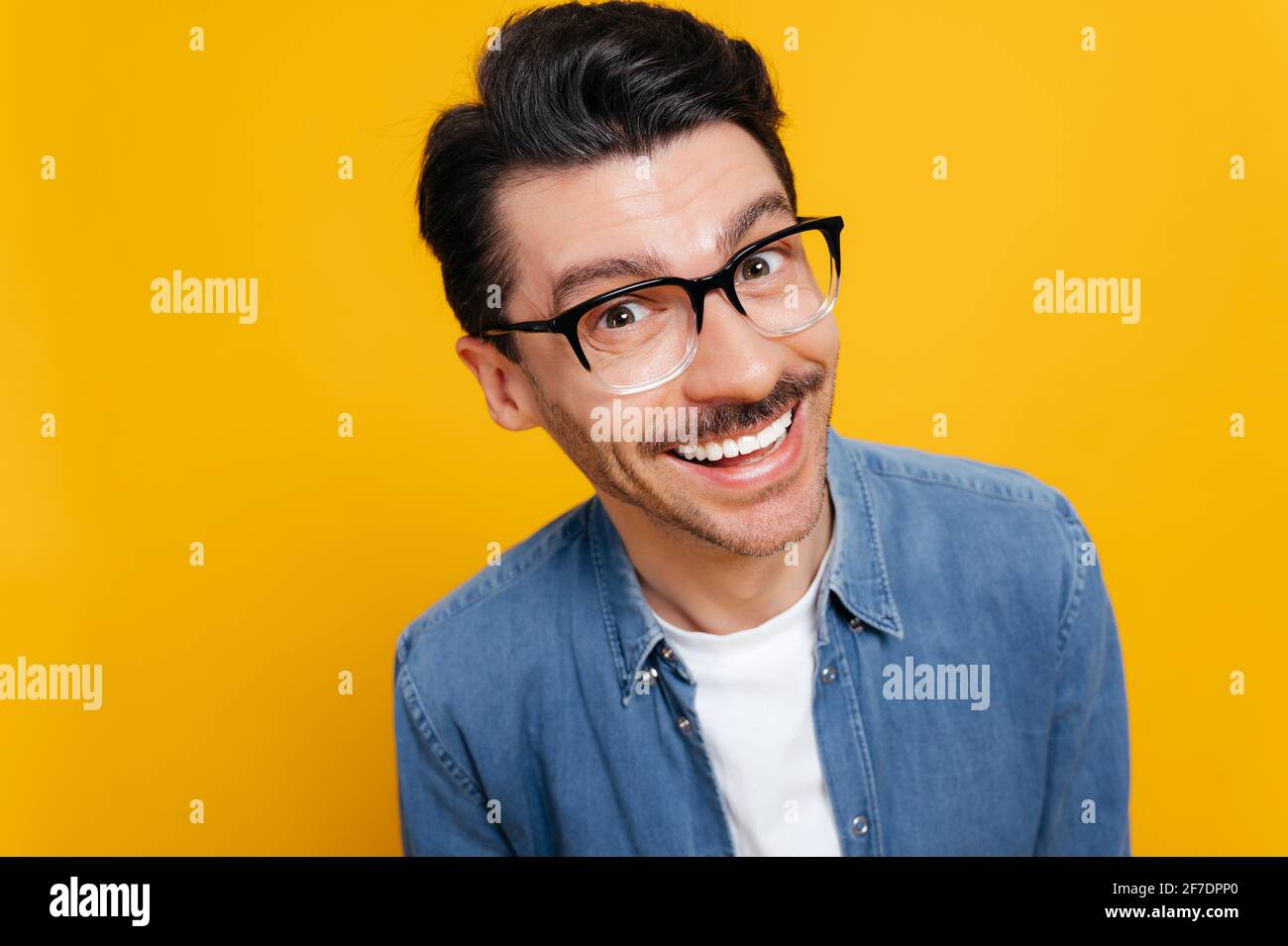 Closeup headshot of a funny cheerful excited attractive caucasian guy