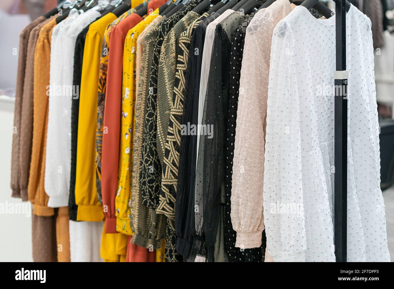 spring and summer women s clothing in the store. bright modern