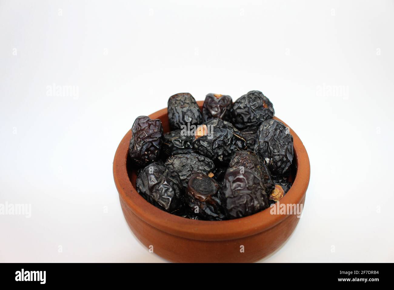 Ajwa dates. Dried dates. Prophet dates on white background. Iftar time Stock Photo