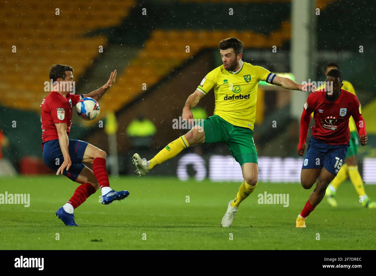 6th April 2021; Carrow Road, Norwich, Norfolk, England, English Football League Championship Football, Norwich versus Huddersfield Town; Grant Hanley of Norwich City challenges Jonathan Hogg of Huddersfield Town Stock Photo