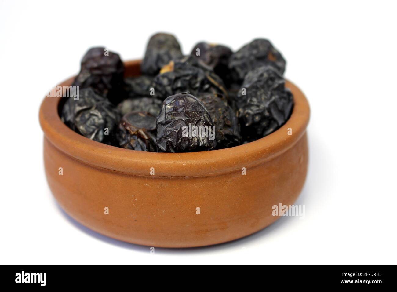 Ajwa dates. Dried dates. Prophet dates on white background. Iftar time Stock Photo