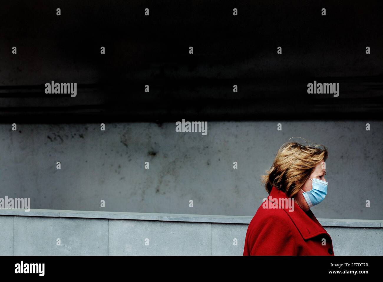 Woman wearing face mask i  the street, Barcelona, Spain. Stock Photo