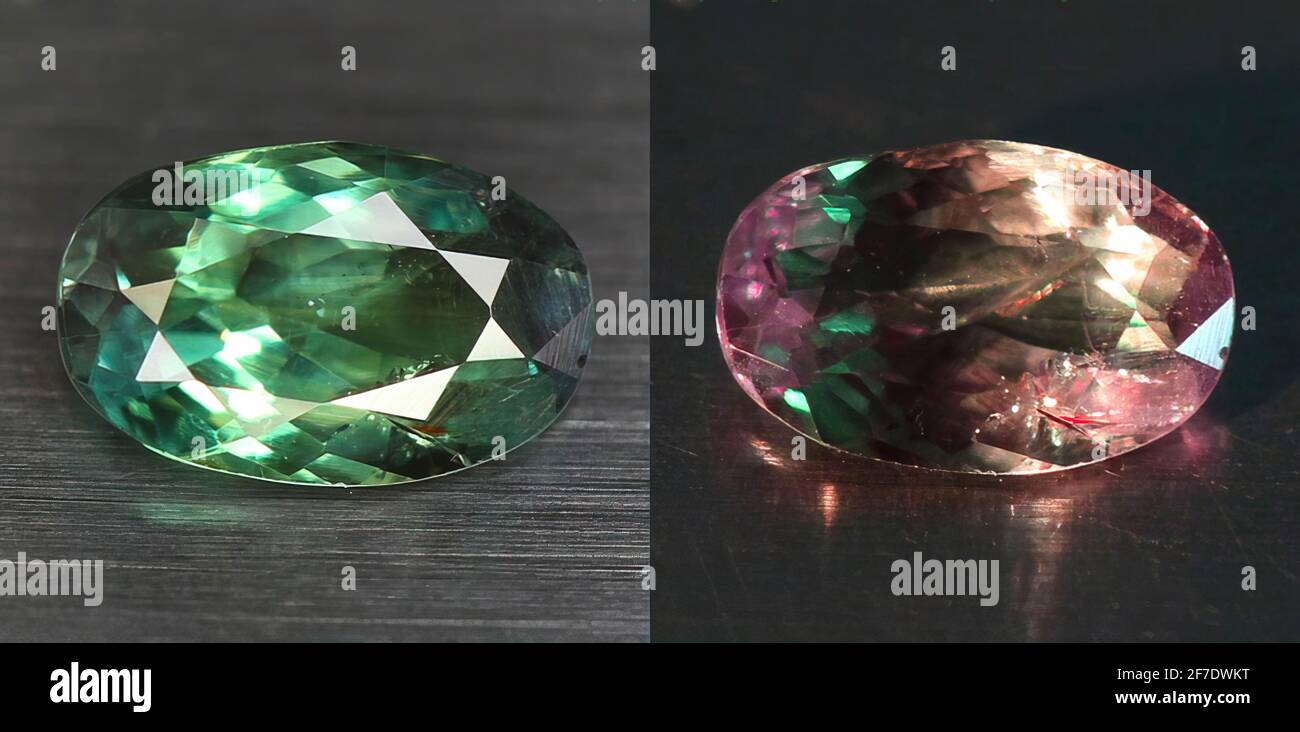 Natural gemstone alexandrite with color change on gray background Stock Photo