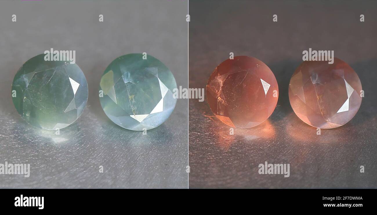 Natural gemstone alexandrite with color change on gray background Stock Photo