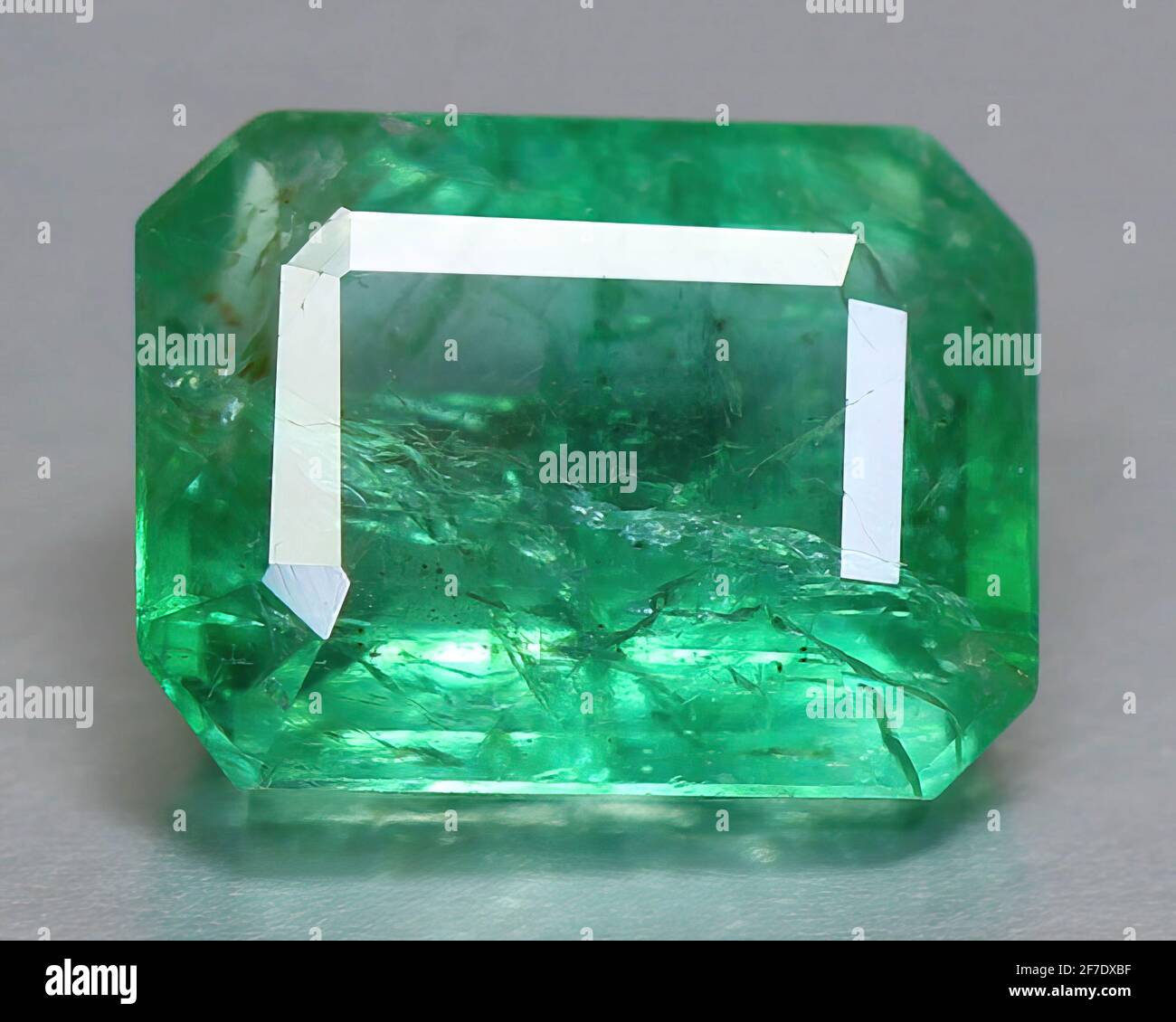 Natural gemstone green emerald beryl on background Stock Photo