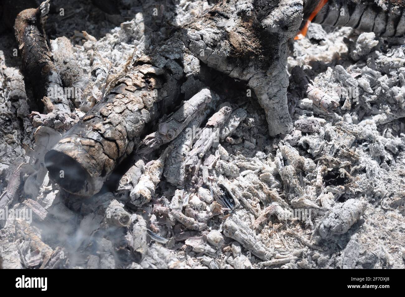 The ashes and charcoal from the fire, background. Stock Photo