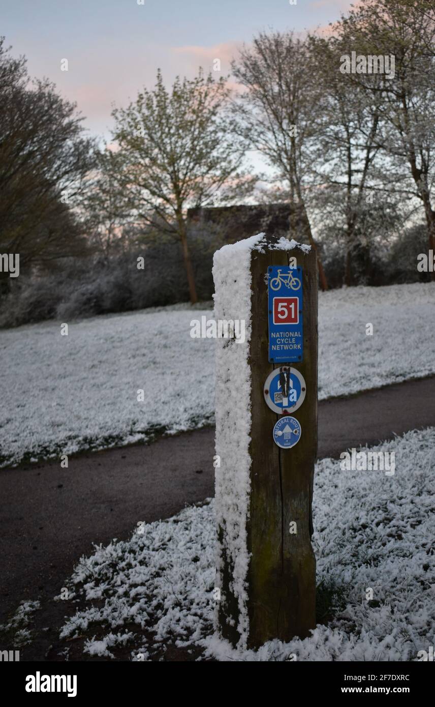 Waymarker on a cycle route in the snow Stock Photo