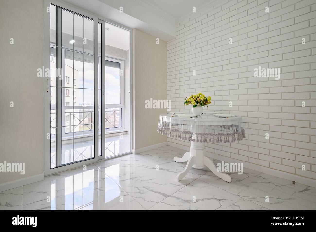 Elegant white round dining table in modern kitchen interior Stock Photo