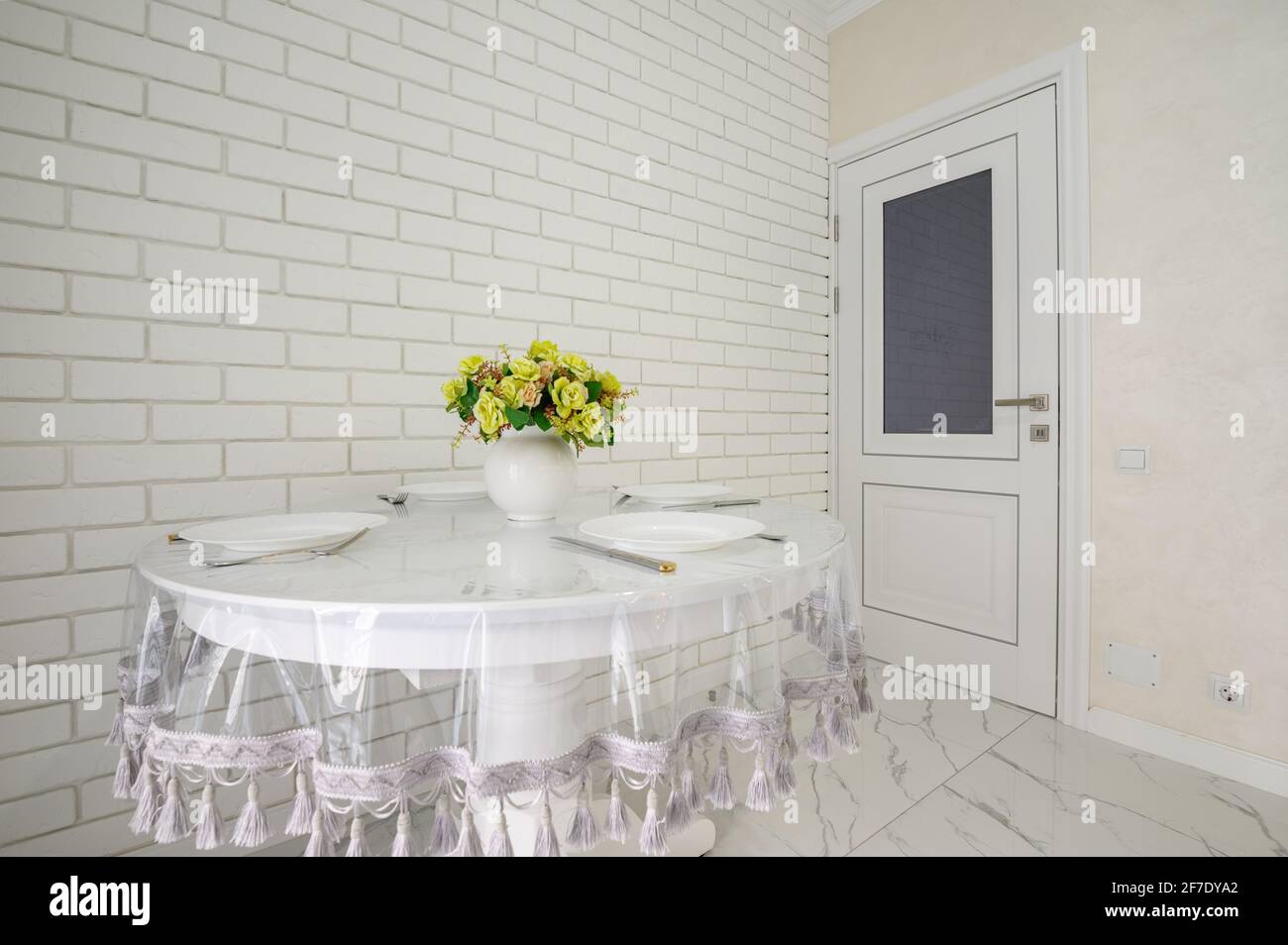 Elegant white round dining table in modern kitchen interior Stock Photo