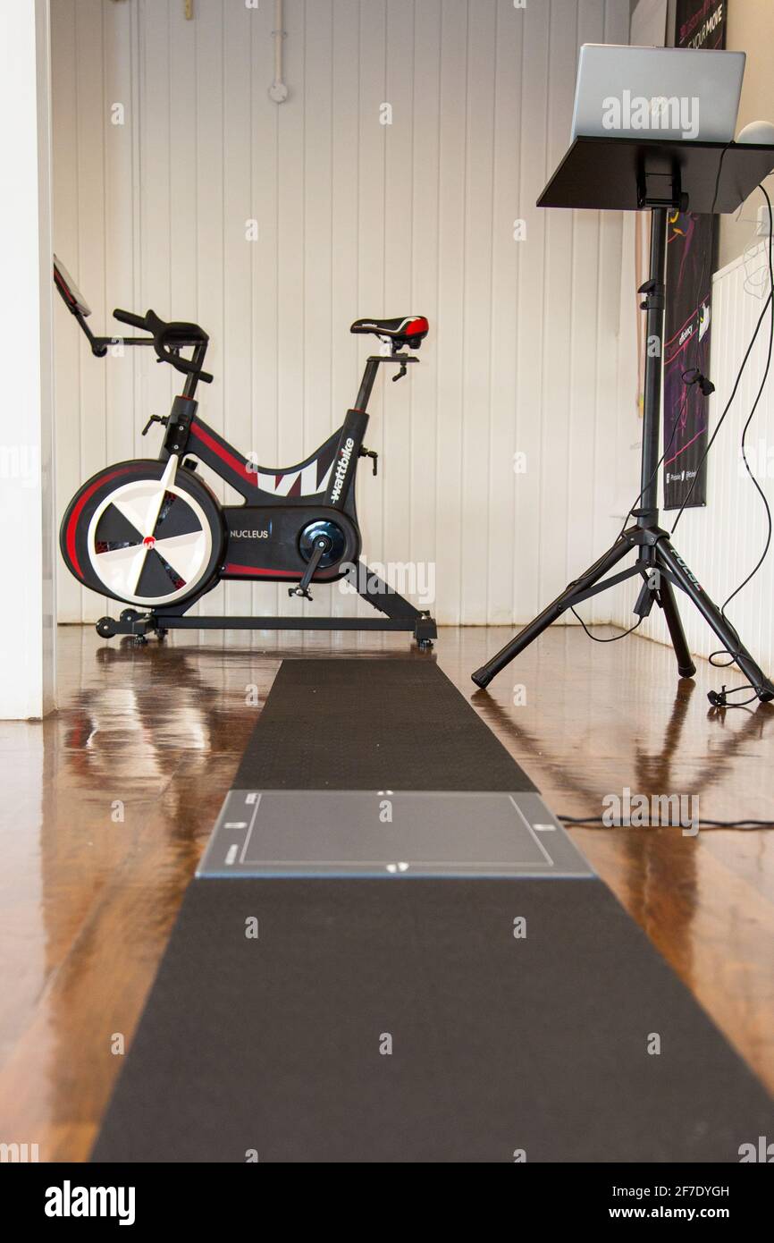 Footscan running track inside a fitness studio with a Wattbike exercise
