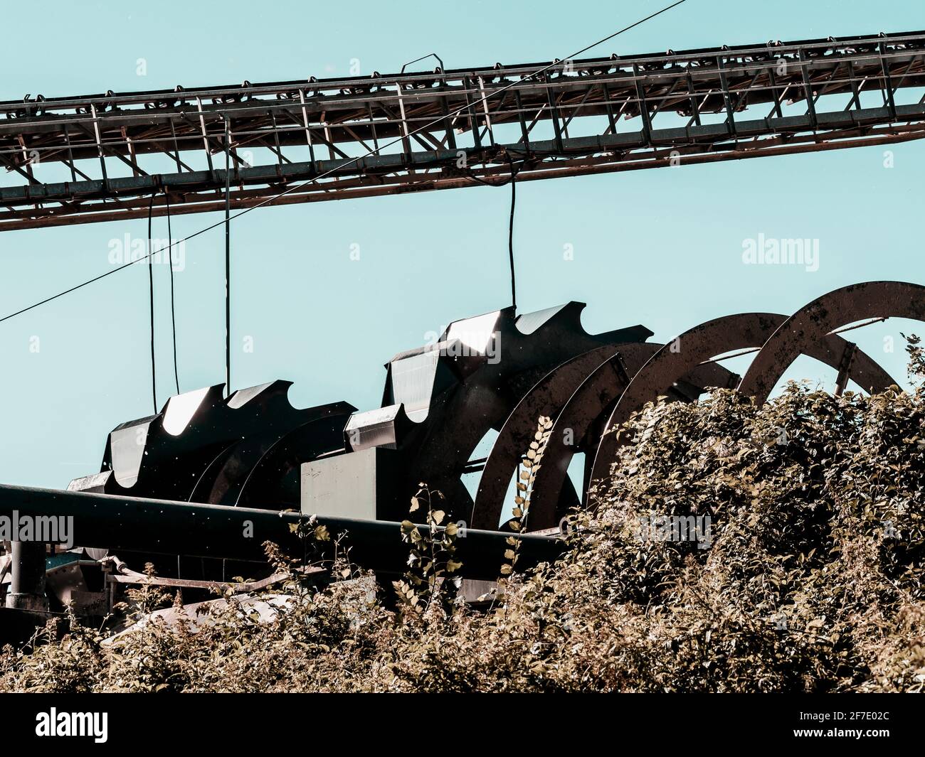 A plant for the production of crushed stone, gravel and sand. Quarry, machines and conveyors. Stock Photo
