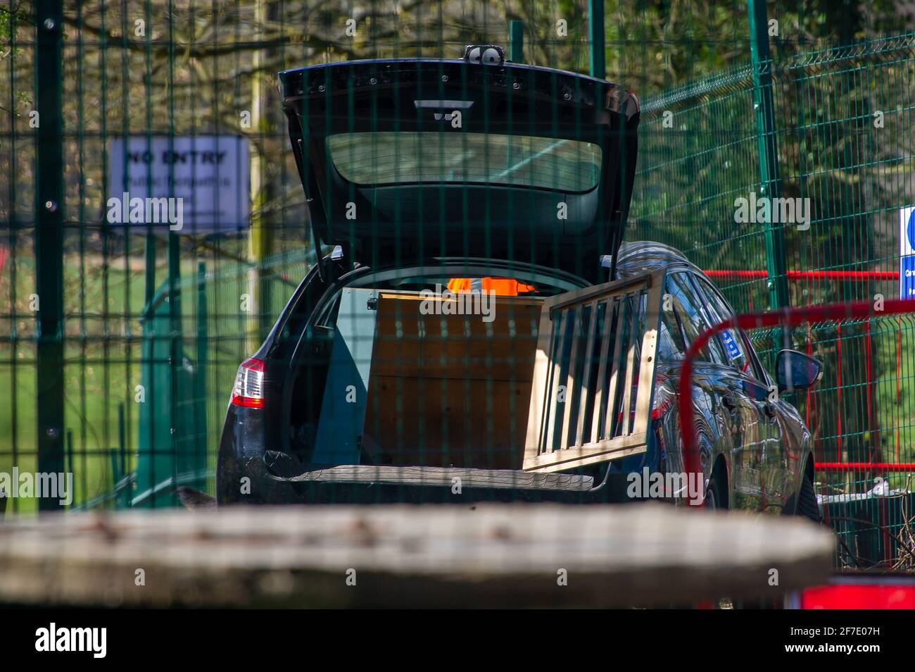 Aylesbury Vale, UK. 6th April, 2021. An HS2 dog handler lets his dog out of a cage in his car. Animal lovers are very concerned about HS2 and their use of guard dogs which are used as a deterrent to Stop HS2 protesters and members of the public walking past HS2 compounds. The High Speed 2 railway from London to Birmingham is having a huge detrimental impact upon wildlife and the environment. Credit: Maureen McLean/Alamy Stock Photo