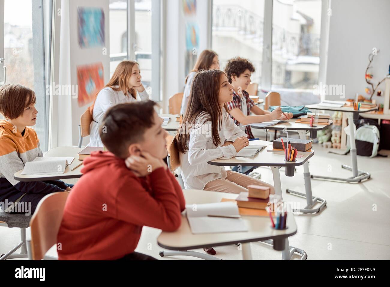 Nice pupils are listening carefully to their tutor. Elementary school