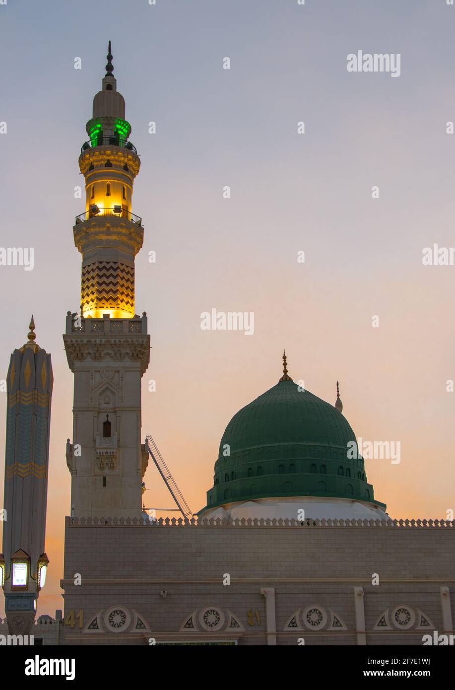 Sunset time in Madinah Munawwarah. An evening view of the beautiful Masjid Nabawi of Medina. Dome of Prophet Muhammad's Mosque Stock Photo -