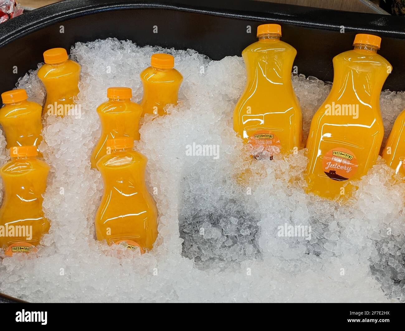 Delicious Bottles of Orange Juice Available for Purchase Stock Photo