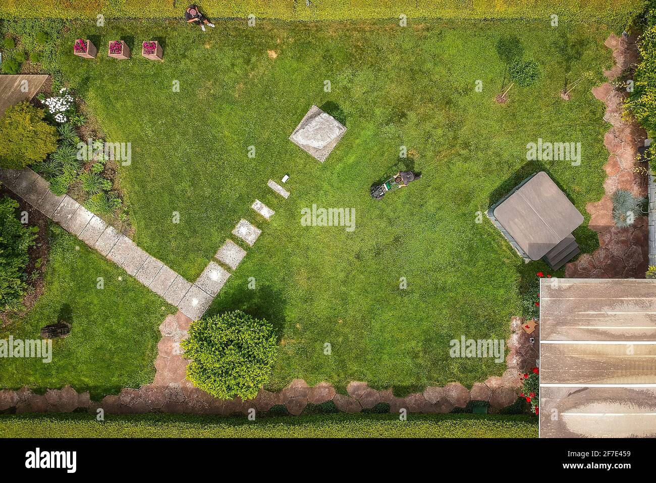 Aerial photo of cable laying machine with an operator to put down