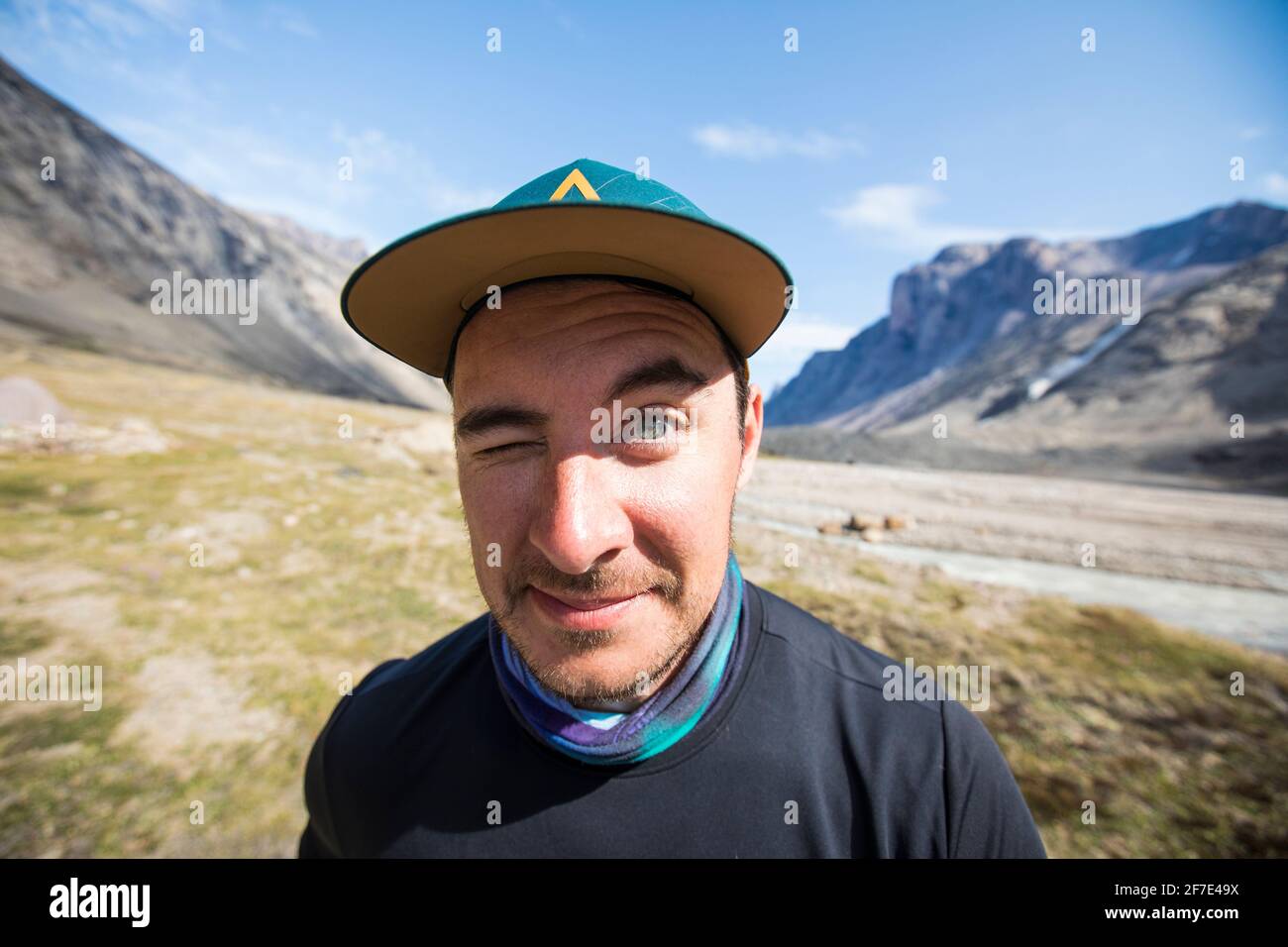 Outdoorsman makes a funny face, one eye open, eyebrow raised. Stock Photo