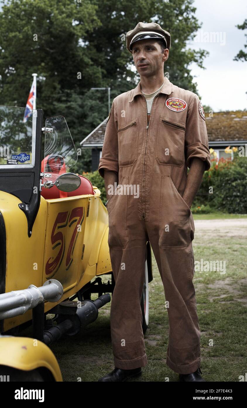 GREAT BRITAIN / England / Male standing next to  hot rod at Hot Rod Hayride. Stock Photo