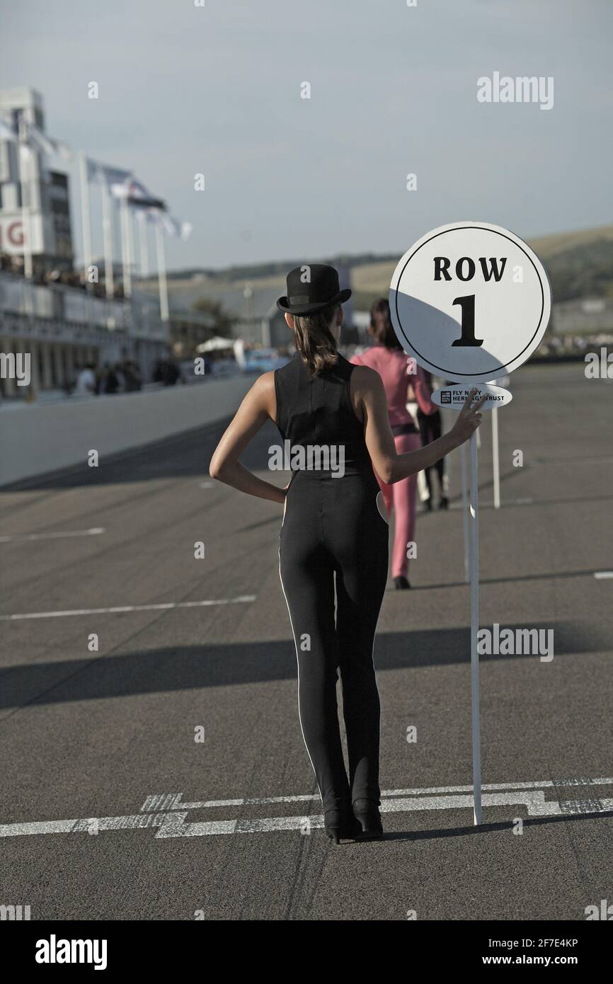starter girls with signs indicating the start row at the Goodwood Revival Meeting 2012. Stock Photo