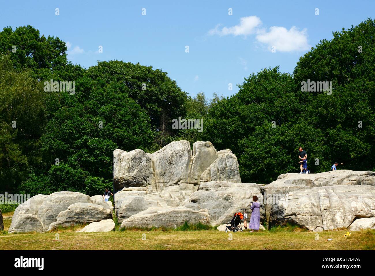 People enjoying a summer's day at Wellington Rocks on Tunbridge Wells Common, Royal Tunbridge Wells, Kent, England Stock Photo