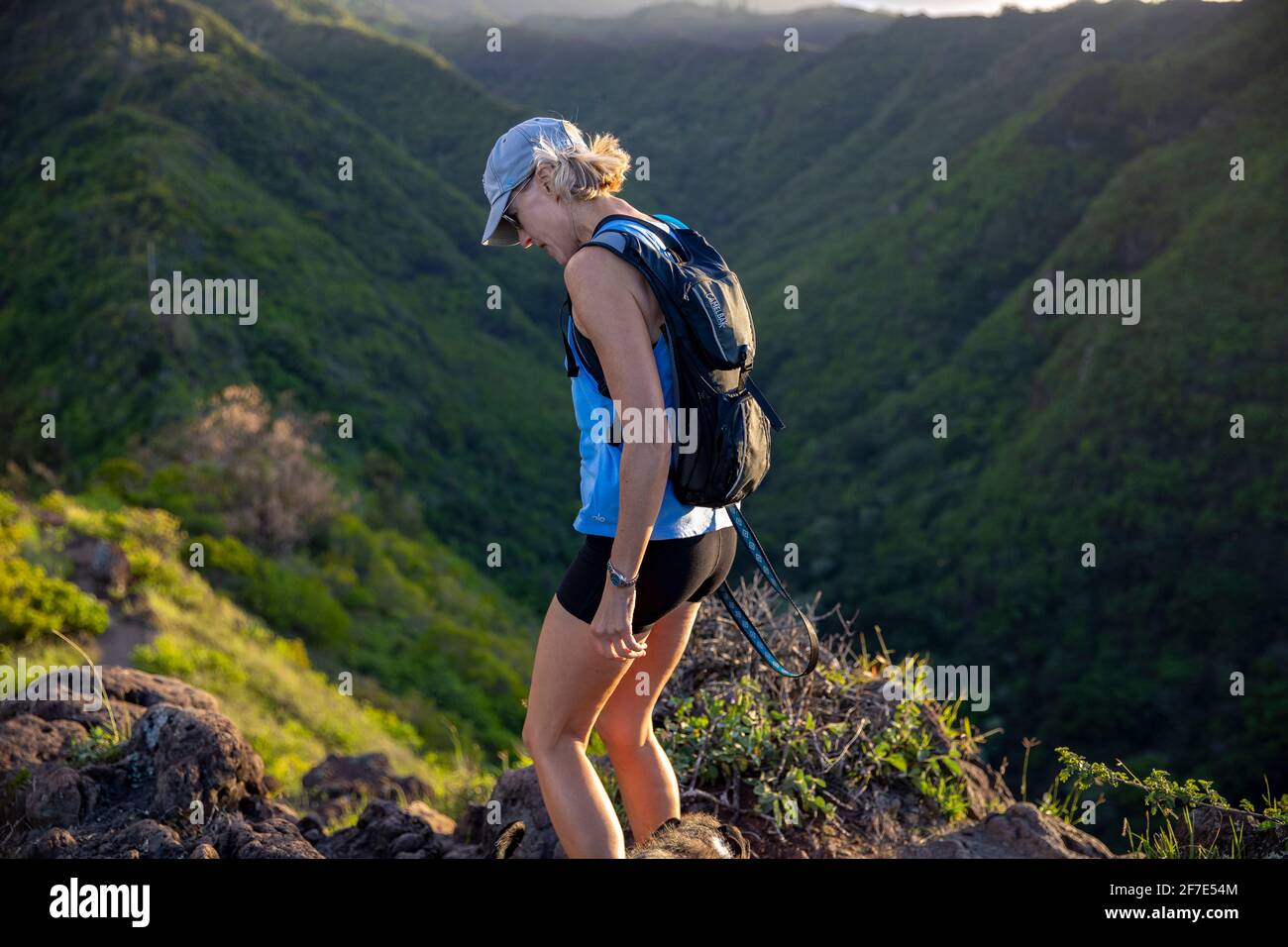 Woman hiking across mountain hi-res stock photography and images - Alamy