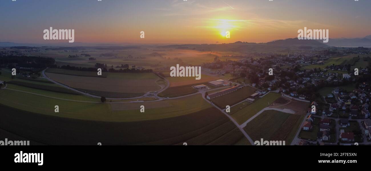 Beautiful misty colorful morning view of the village of Sankt Georgen im Attergau, idyllical austrian village in early morning, at sunrise. Epic sunri Stock Photo