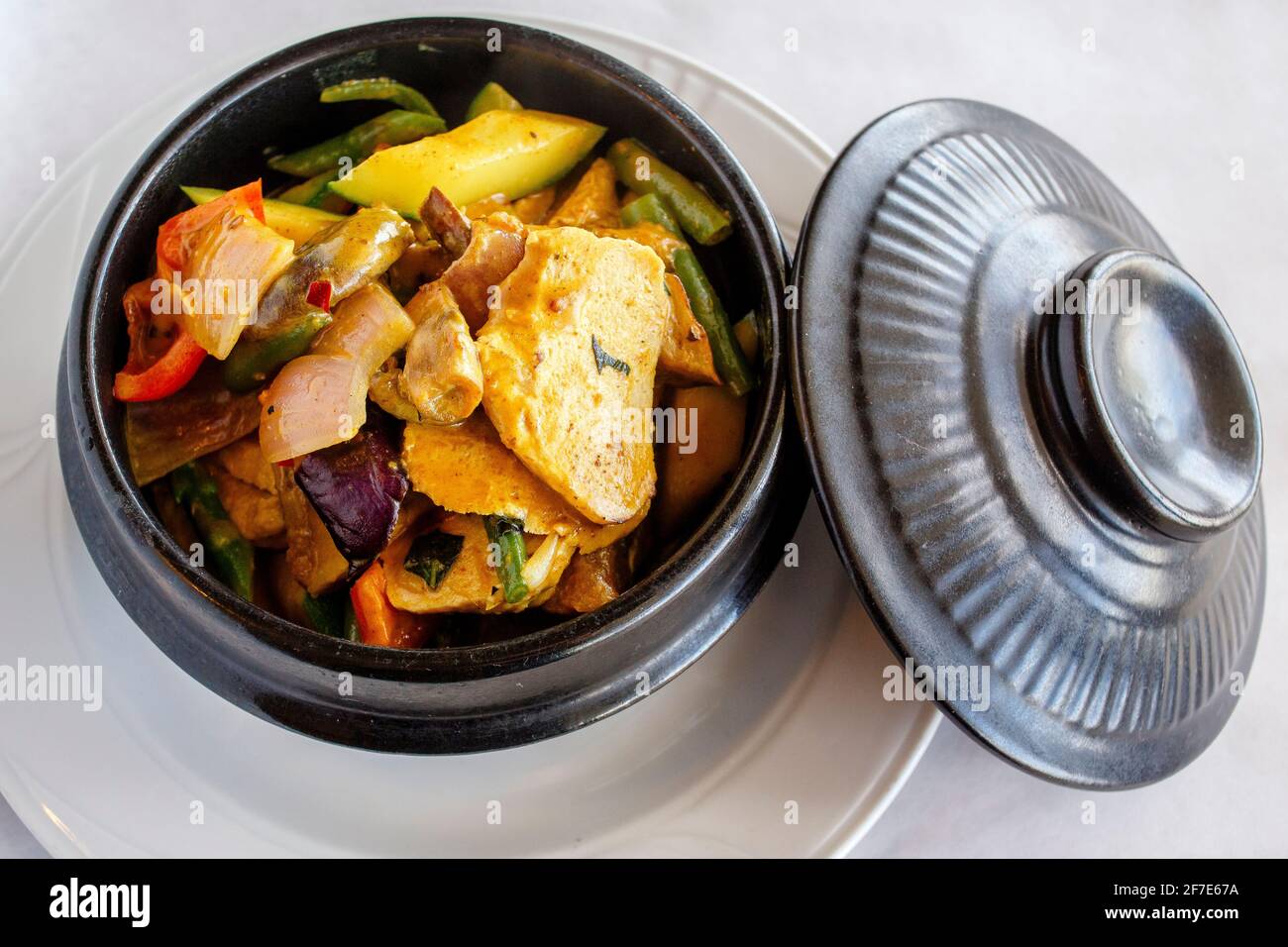 Clay pot of Chinese tofu and vegetable in sauce Stock Photo