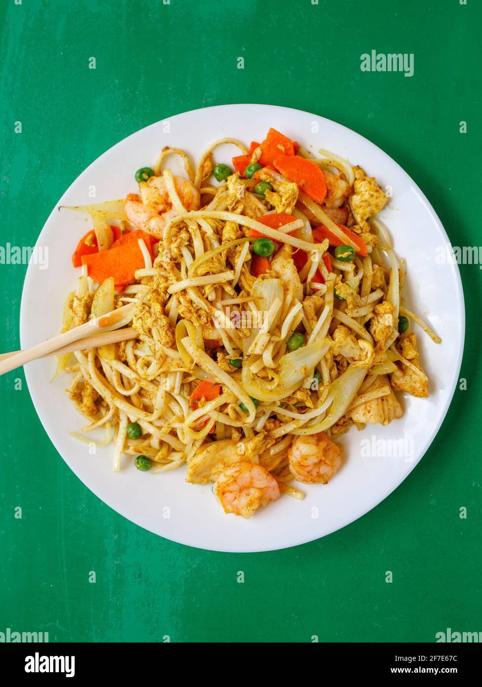 Above-view of Chinese seafood noodles and chopsticks Stock Photo