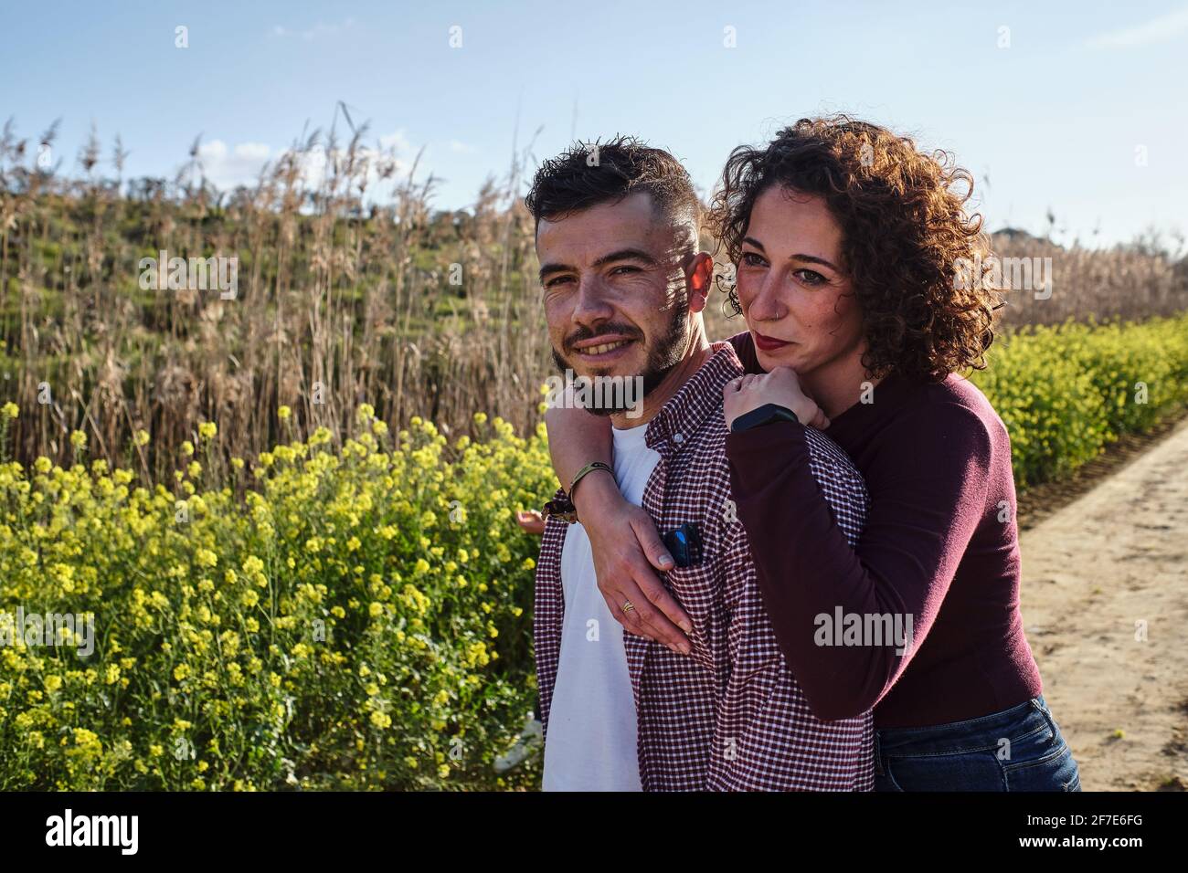 portrait of happy couple walking in the countryside Stock Photo