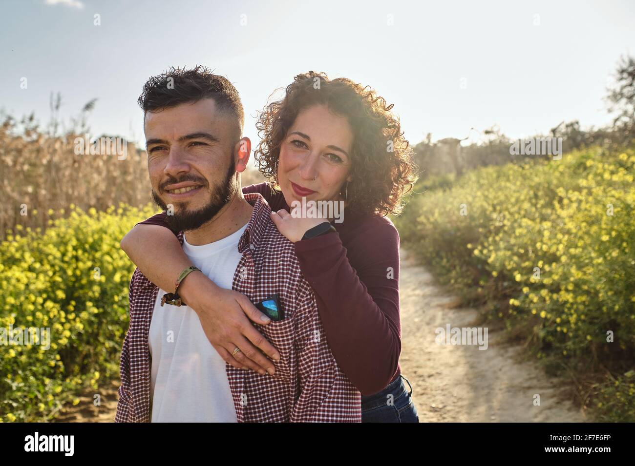 portrait of happy couple walking in the countryside Stock Photo