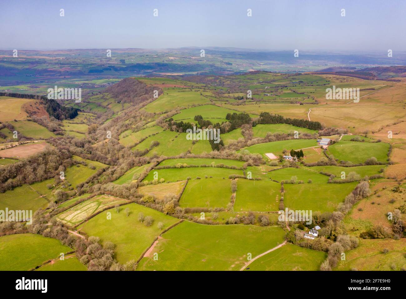 Aerial view of rural farmland and hills in Wales (Hay Bluff on the