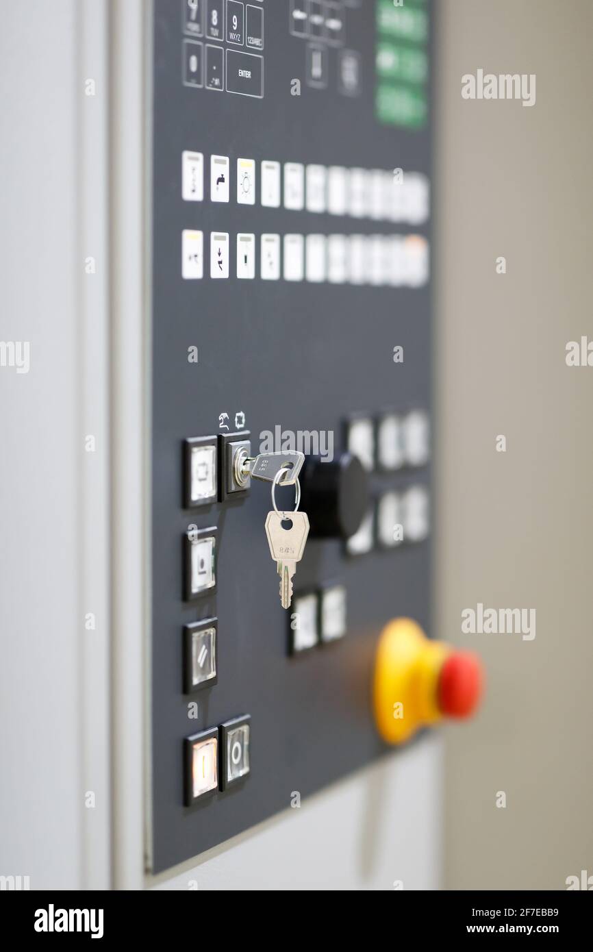 Key switch on a control panel of industrial machine. Selective focus ...