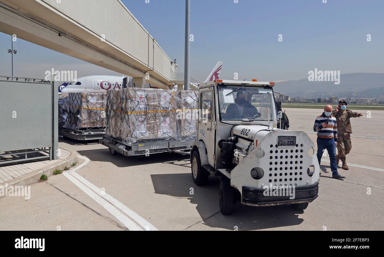 Beirut, Lebanon. 6th Apr, 2021. Staff transport the Sinopharm vaccines donated by China at the Rafic Hariri International Airport in Beirut, Lebanon, April 6, 2021. Two batches of Sinopharm vaccines donated by China arrived in Lebanon on Tuesday. Credit: Bilal Jawich/Xinhua/Alamy Live News Stock Photo