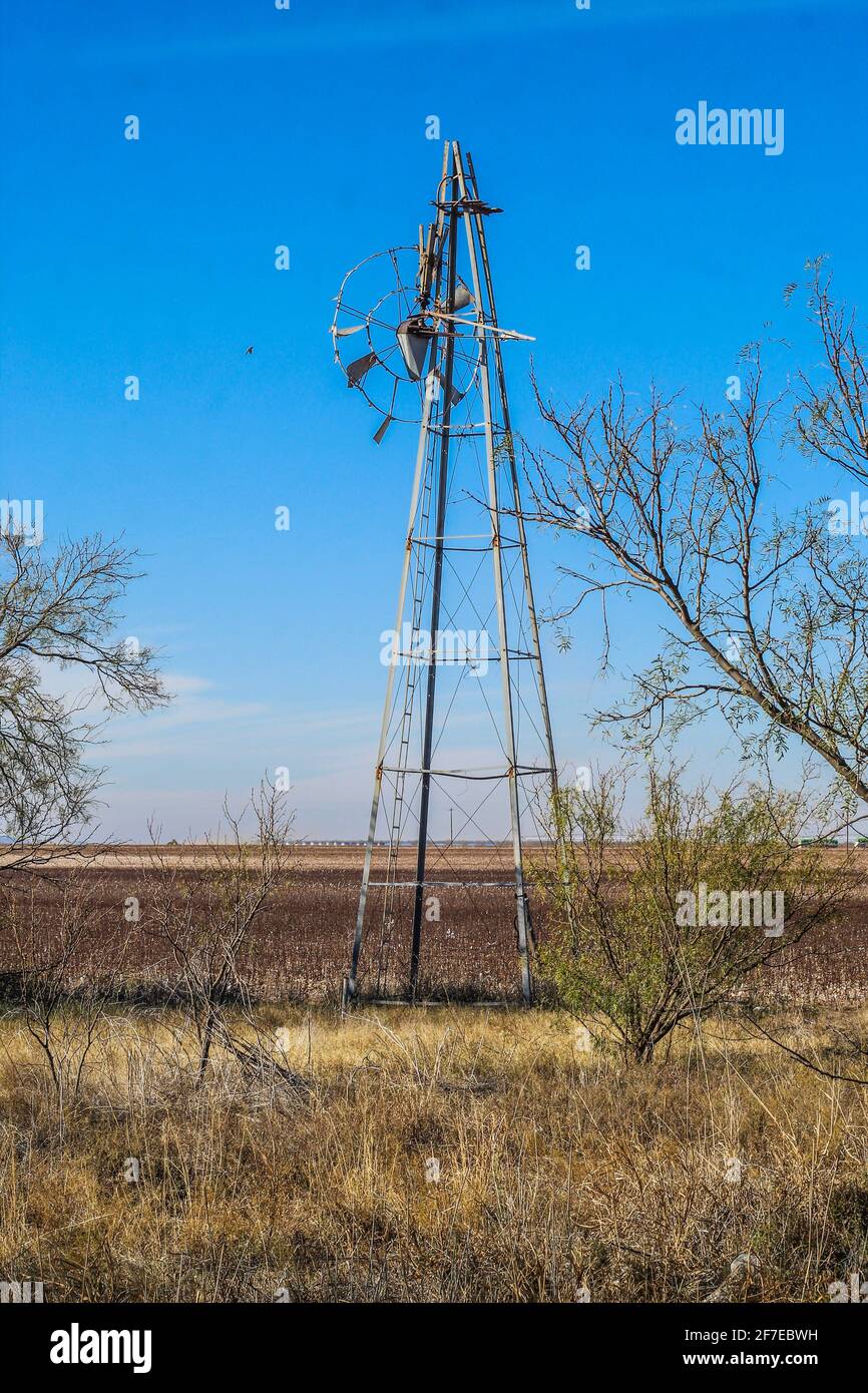 Abandoned windmill that's seen better days. Stock Photo