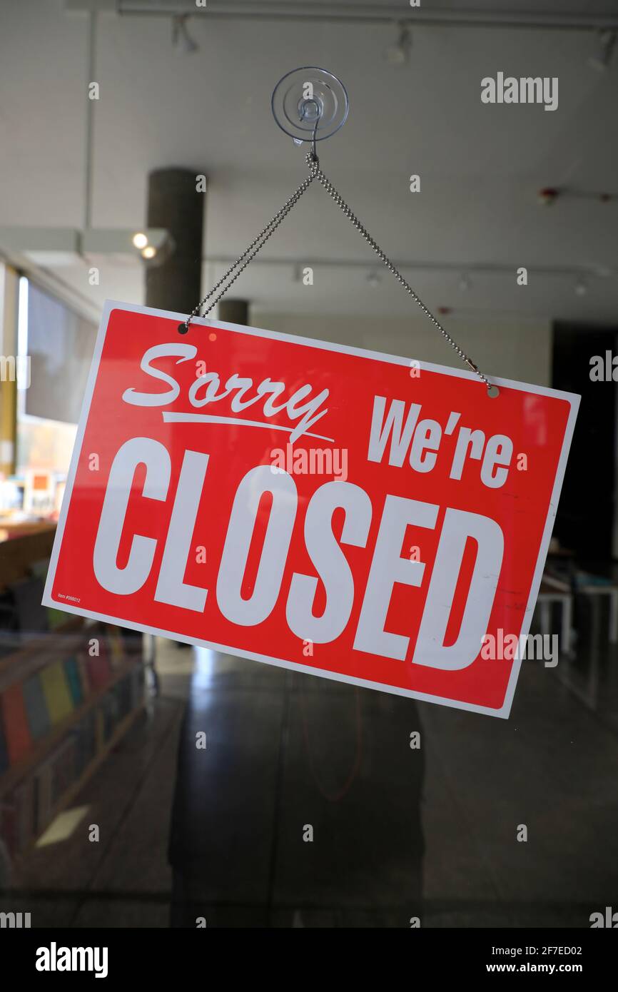Sorry We are Closed sign on a glass door.Harvard University.Cambridge.Massachusetts.US Stock Photo