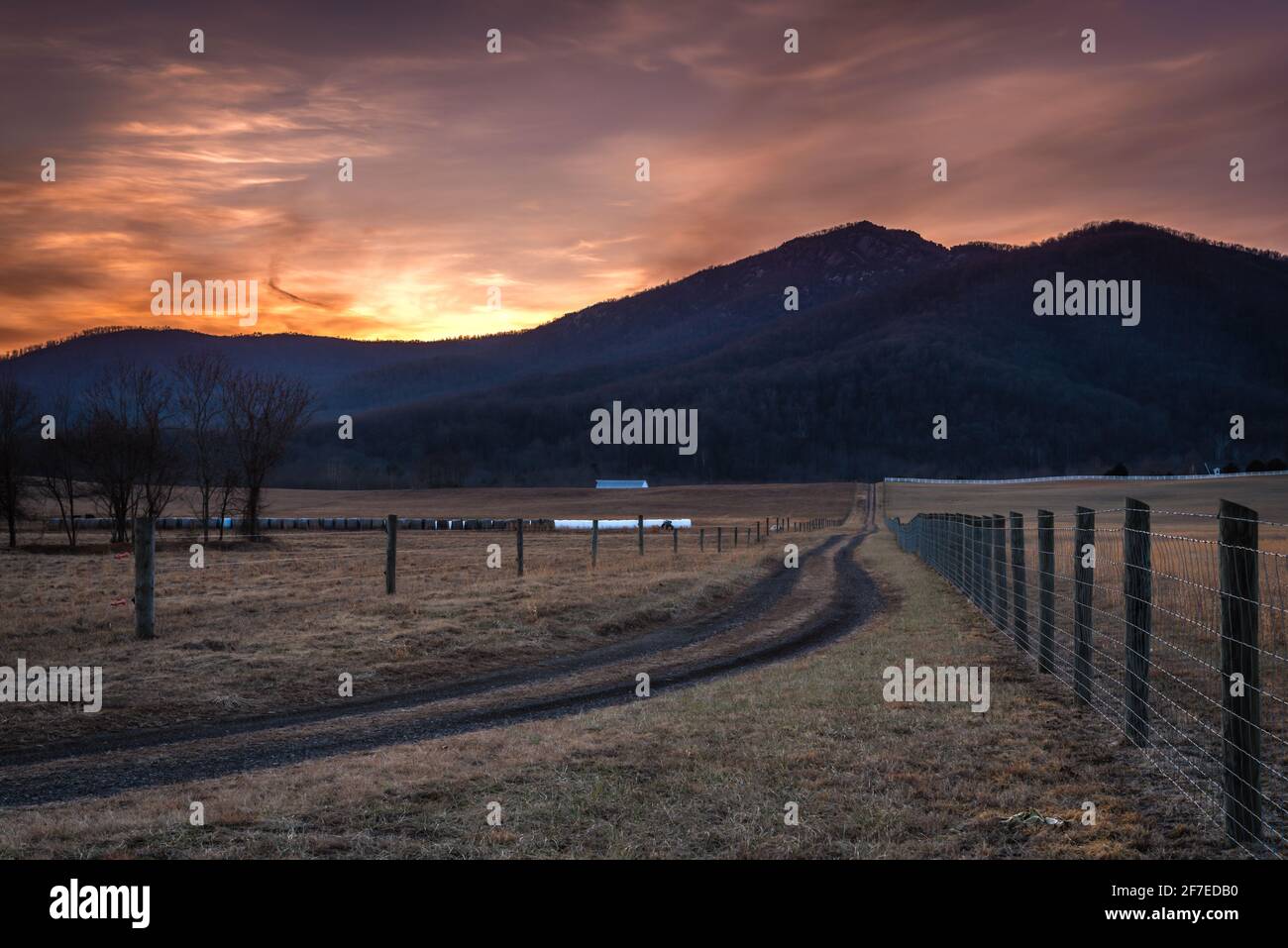 The sun setting behind Old Rag Mountain of Shenandoah National Park ...