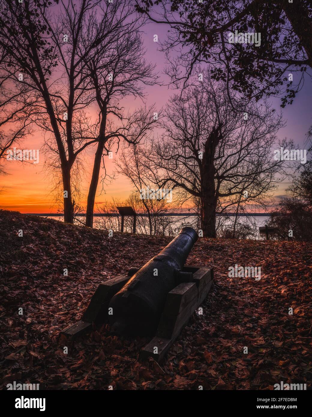 A colorful sunrise of a canon emplacement at Leesylvania State Park, which was a Confederate lookout along the Potomac River during the USA Civil War. Stock Photo