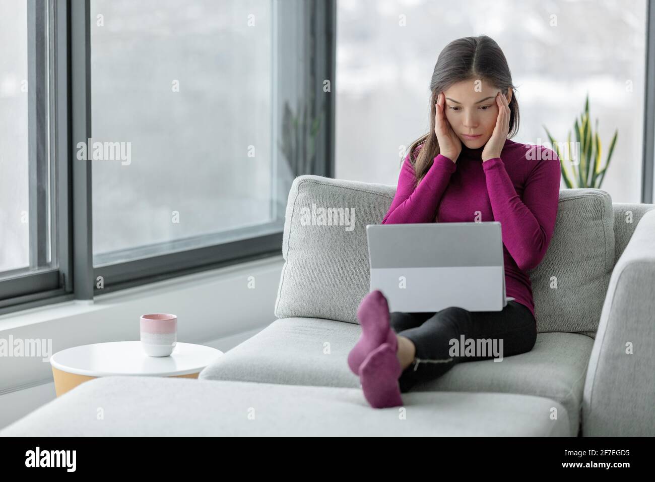 Computer problem laptop not working at home frustrated Asian woman with ...