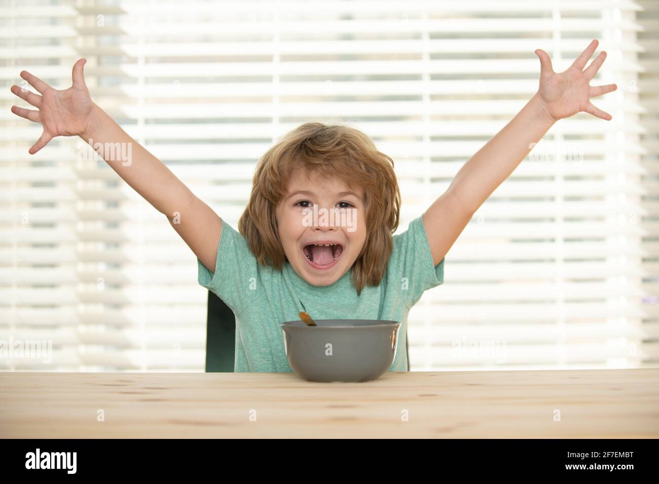 Funny excited kid with plate of soup. Child funny dinner Stock Photo - Alamy